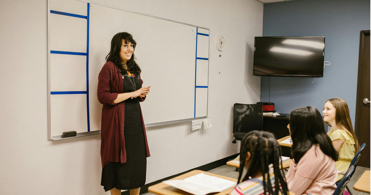 Indian English teacher teaching in class