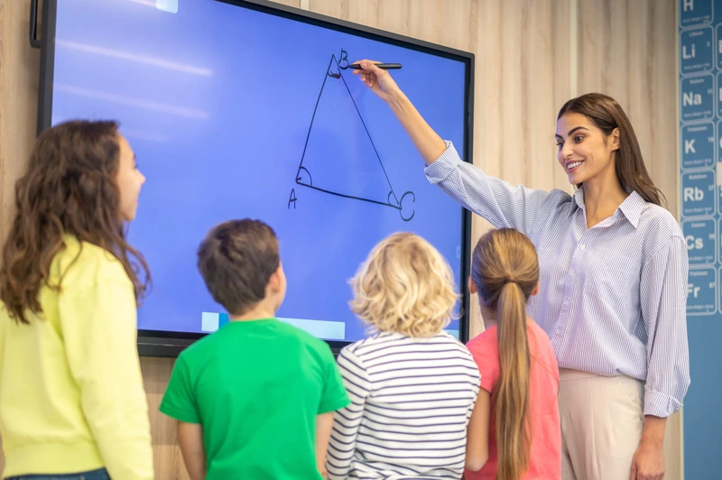 Woman Drawing Showing Triangle Blackboard Children